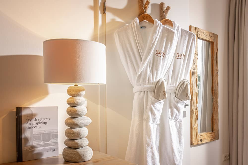 Sand bathrobes in a Little Two + View room.