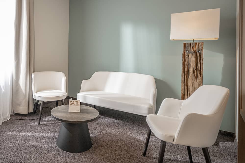 Sitting area in the small living room of an And More room.