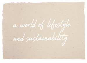 Schreibschrift Text auf Papierausschnitt mit dem Ausspruch „a world of lifestyle and sustainibility“